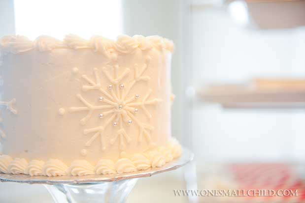 Snowflake Cross Christening Cake | Winter Christening Ideas at One Small Child