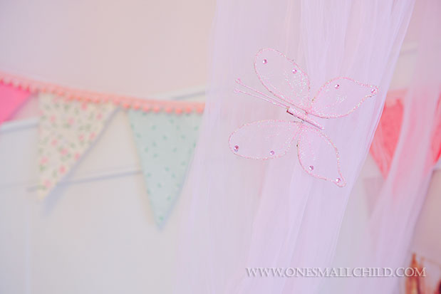 Great idea for dressing up a pink crib canopy | See the entire nursery at One Small Child: www.onesmallchild.com