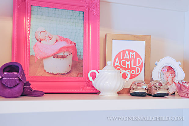 Fun shelf display for decorating a baby girl's room | See the entire nursery at One Small Child: www.onesmallchild.com