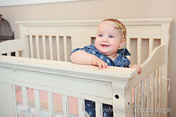 Love the look of distressed furniture! | See the rest of Lily’s nursery at One Small Child: www.onesmallchild.com