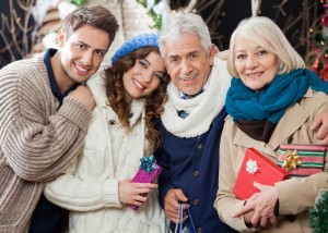 Happy Loving Family Standing In Christmas Store - One Small Child