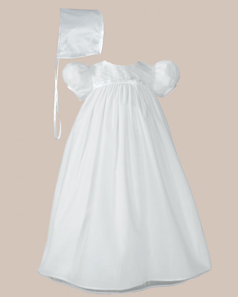 baby in christening gown